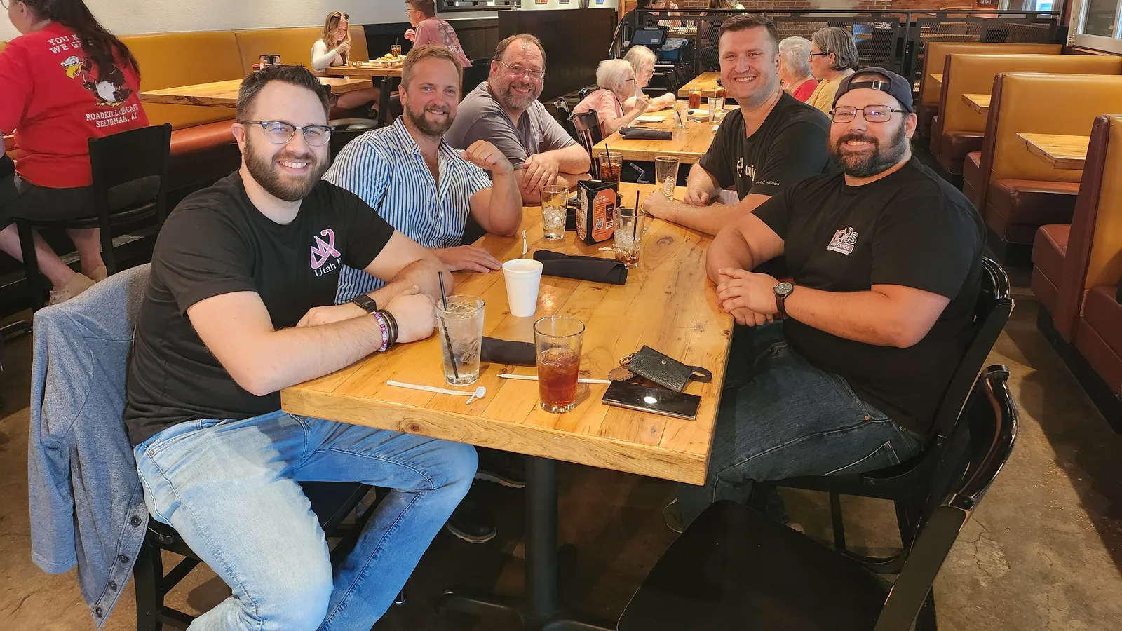 The MythWeaver team around a table